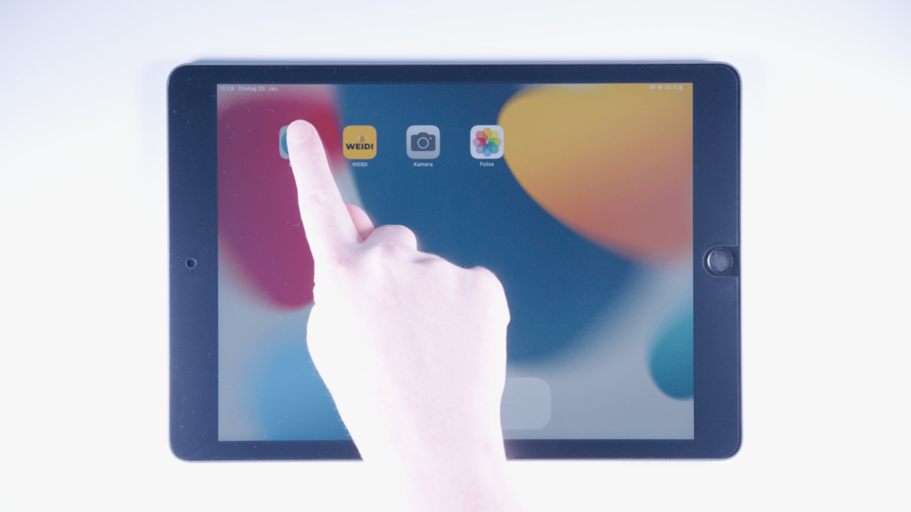iPad-Startbildschirm: Finger liegt auf Safari-App.
