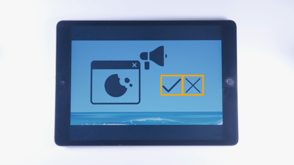 (iPad:) Grafik Werbe Cookie: Cookie-Datei, + Megafon-Grafik (rechts überhalb); linke Bildschirmhälfte Grafik Haken + Kreuz (für Ja oder Nein); rechte Bildschirmhälfte